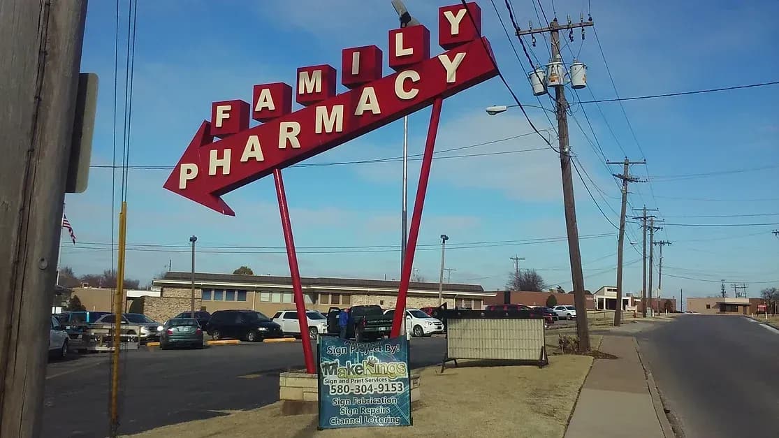 Tall red Family Pharmacy pole sign