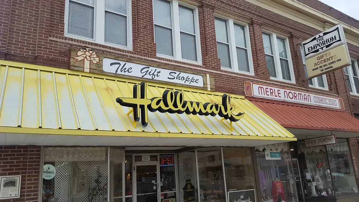Storefront awning and signage for a Hallmark gift shop