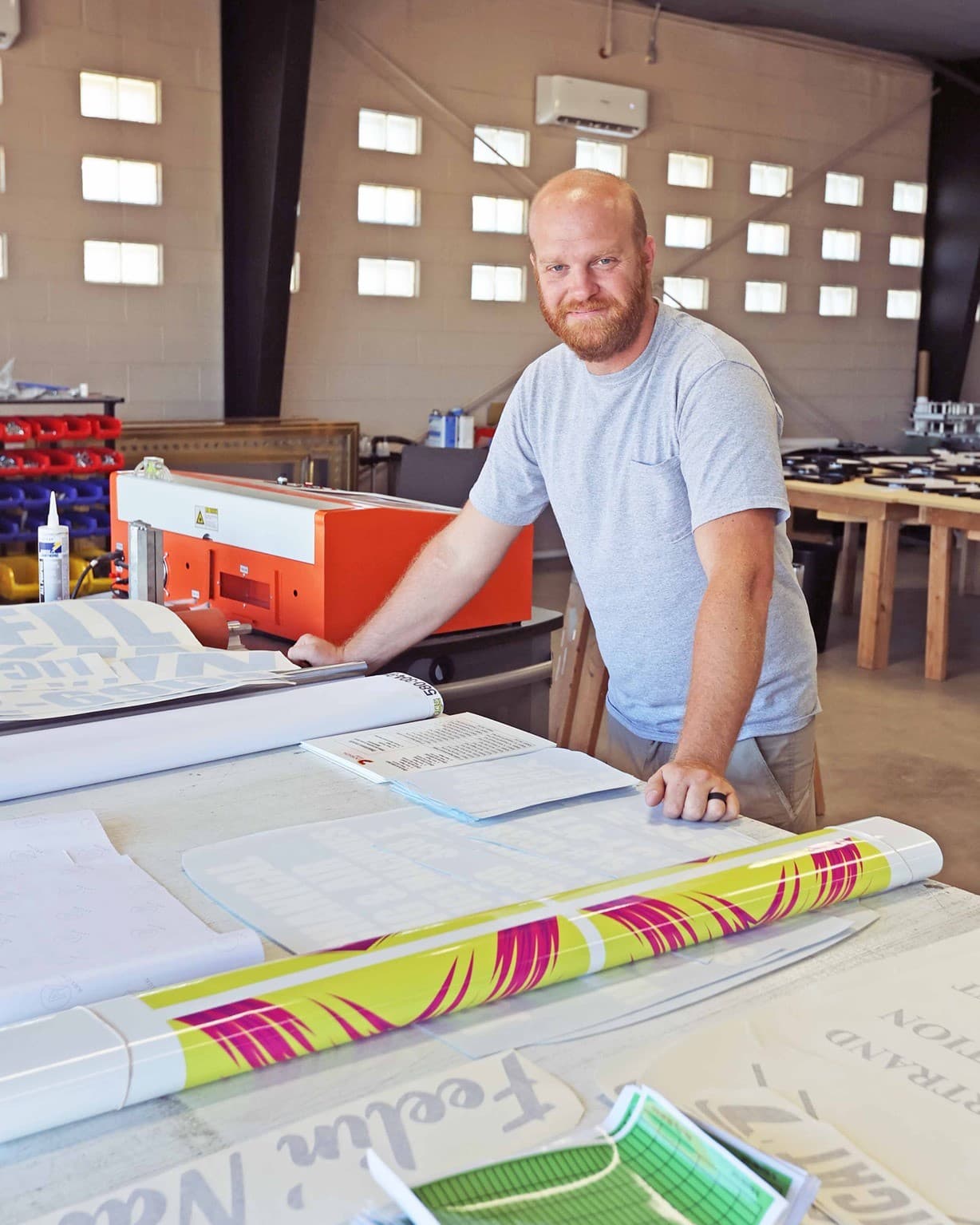 MakeKings owner in the workshop preparing a custom vinyl print